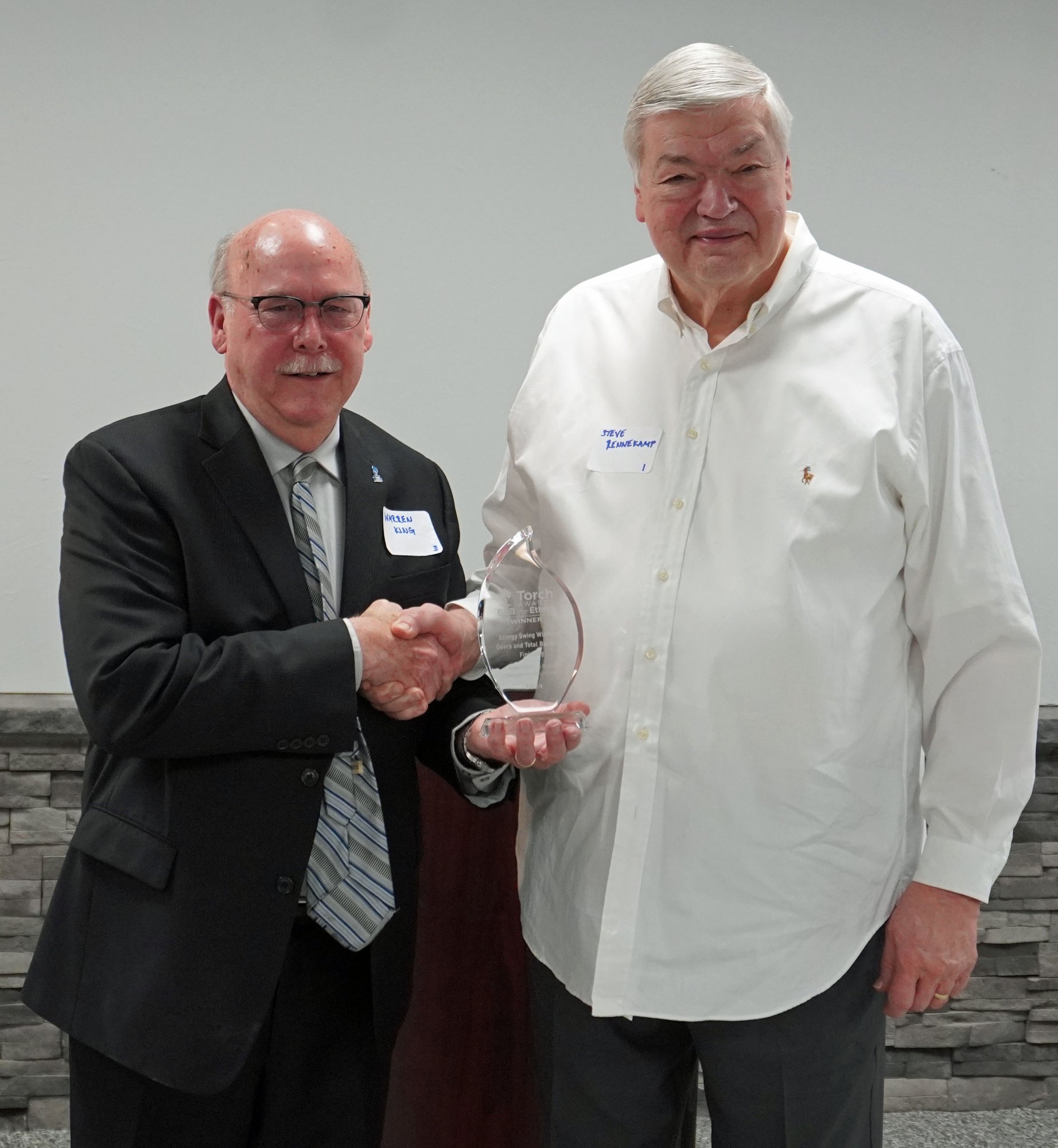Warren King Giving Torch Award to Steve Rennekamp