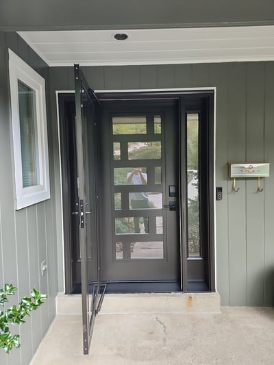 Modern steel entry door with decorative glass