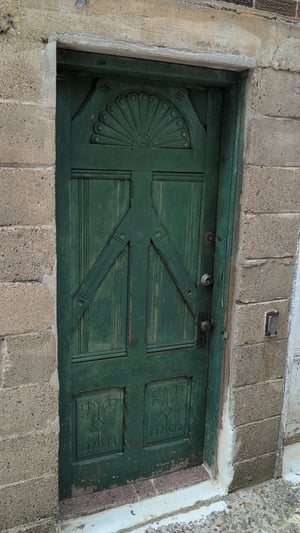 ornately-carved-wood-door