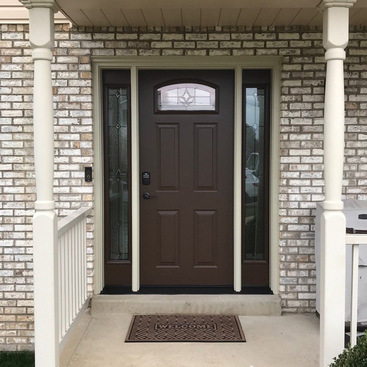 Brown Steel entry door with decorative glass at top and on sides