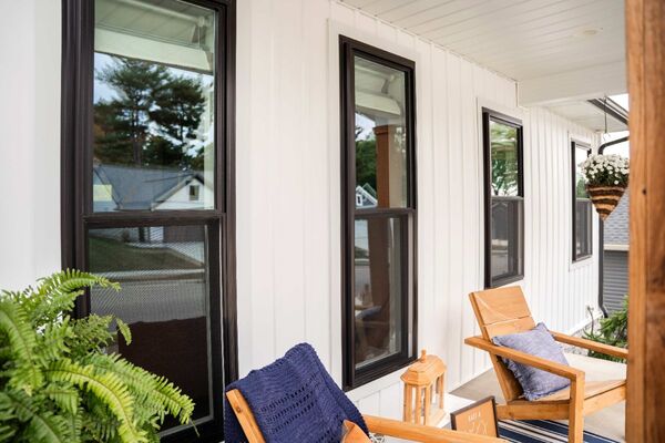 Coal Black ProVia Endure double hung windows on a home's front porch