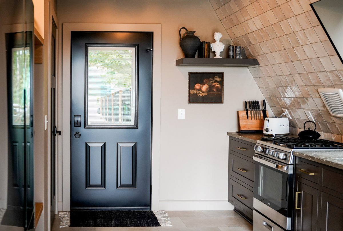 Black half-glass ProVia steel door from inside the kitchen