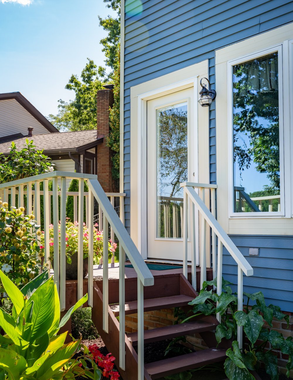 White full-glass ProVia steel back door off a deck