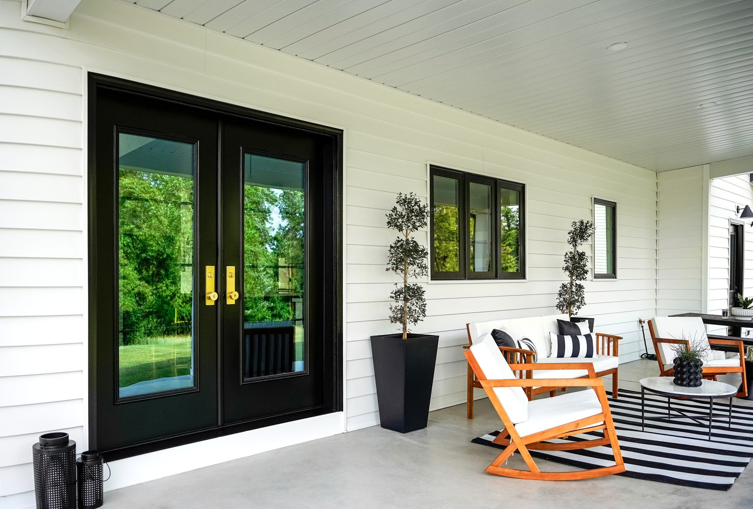 Black ProVia Legacy steel French doors on a back patio