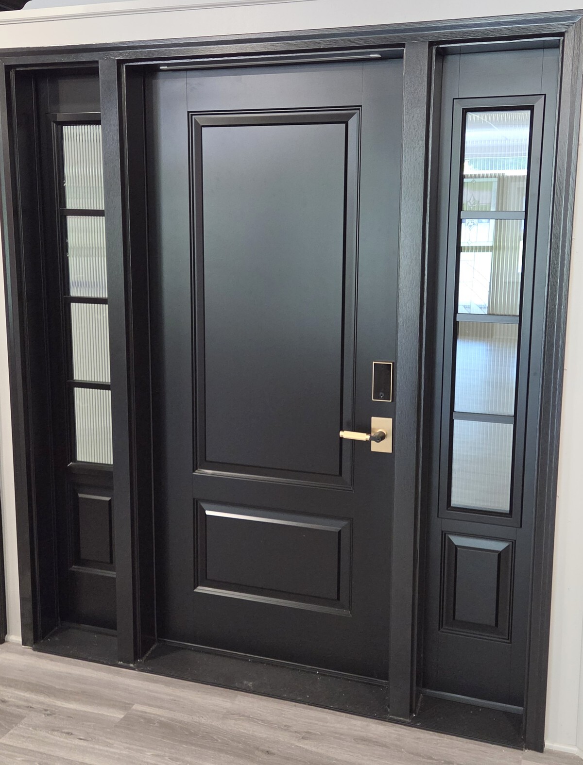 Black ProVia Ascent fiberglass entry door with two sidelites at the Energy Swing ProVia Experience Center