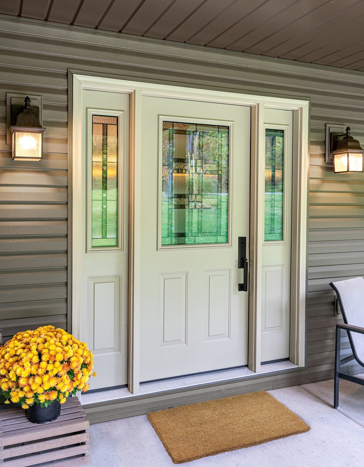 ProVia Legacy steel entry door with decorative glass and two sidelites on a front porch