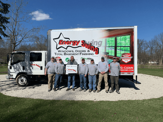 energy Swing installation team standing in front of truck with a customer