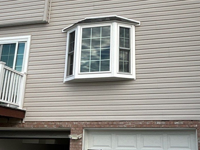 White Energy Swing bay window with two double hung windows and a center picture window