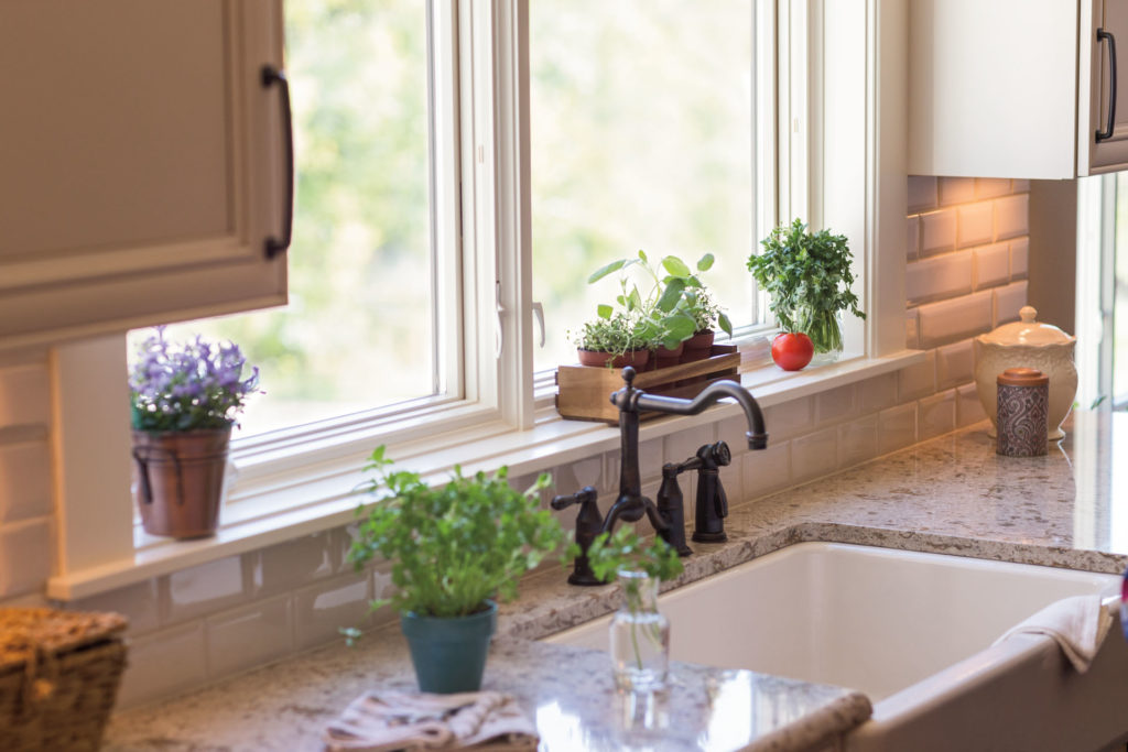 casement windows over a sink in kitchen