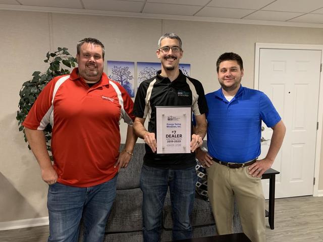 Total Basement Finishing expert, Zach Fontecchio, holding award plaque.