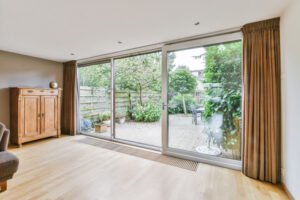 Modern sliding glass doors facing the courtyard