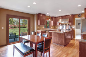 A nice living room with dining set having open modular kitchen