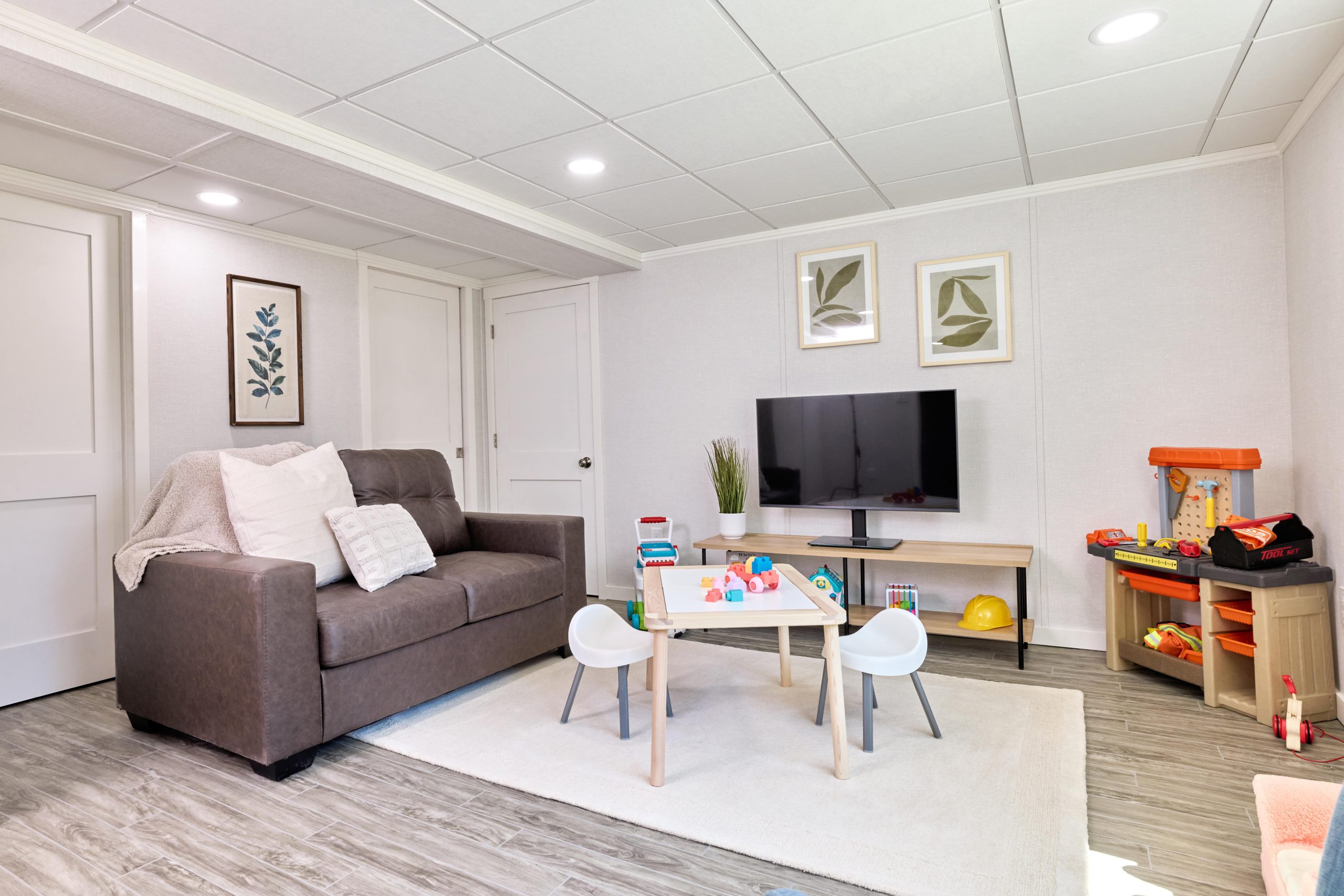 Finished basement that is set up as a second living area with child playroom